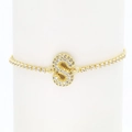 Detailed close-up of 18k gold plated tennis bracelet with sparkling pave zircon letter S - Letter S