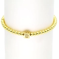 Detail of 18k gold cube charm with crystal letter B on a beaded stretch bracelet - Letter B