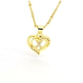 Detailed macro view of 18k gold heart necklace with white zircon pavé and layered design - English Letter X(X)