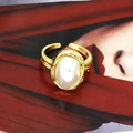 Close-up of vintage adjustable gold-plated ring featuring a large white oval pearl - Baroque Large Pearl Style (05#)