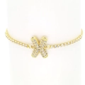 Detailed macro view of 18k gold plated tennis bracelet featuring a micro-pave zircon X charm - Letter X