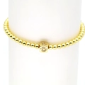 Detail of 18k gold bead elastic bracelet with a zircon-inlaid square initial D charm - Letter D
