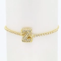 Detailed close-up of a 18k gold-plated Z letter tennis bracelet with white zircons - Letter Z