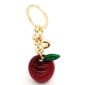 Detailansicht roter Glitzer-Apfel-Schlüsselanhänger mit goldenem Ring und grünem Blatt - Dunkelrot Glitzer Stil (A1)