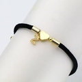 Detail of black woven cord bracelet featuring gold heart charm and Z letter in cubic zirconia - Letter Z
