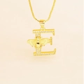 Macro detail of gold letter E necklace featuring a small bee and cubic zirconia stones - Letter E