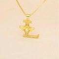 Macro detail of gold letter L pendant with pavé crystals and a 3D bee design on a fine chain - L