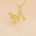 Close-up of golden letter M pendant with paved crystals and a 3D bee on a box chain - M