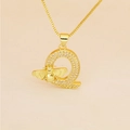 Macro view of gold letter Q pendant with micro-pave zircons and delicate bee detail - Letter Q