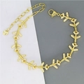 Golden bracelet with sparkling airplane charms and zircon stones on a white background - Plane Style (D2)
