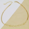 Detailed macro of gold Cuban link chain necklace with nine crystal-encrusted mini crosses - Cross (AC89) / Gold