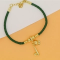 Detailed close-up of a green leather cord bracelet with golden baseball theme charms - Green Rope - Baseball Theme