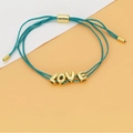 Detail view of adjustable blue woven rope bracelet featuring golden LOVE letter beads - LOVE Letter Style (C2) / Lake Blue (C2)