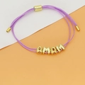 Detail of adjustable purple woven bracelet featuring golden MAMA letter beads and metal slider - MAMA Letter Style (C3) / Purple (C3)