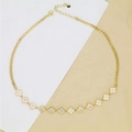 Detailed close-up of golden clover necklace with sparkling white pavé stones on Cuban chain - Four-leaf Clover (AC89) / Gold