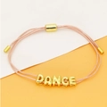 Minimalistische verstelbare roze geweven touwarmband met gouden letters DANCE - Lichtroze (C6)