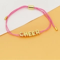 Detailed macro view of pink braided cord bracelet with gold letter beads spelling CHEER - CHEER Letter Style (C4) / Pink (C4)