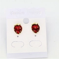 Detailed view of red strawberry stud earrings with gold plating on a white jewelry card - Red Strawberry Style / Red