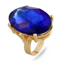 Golden adjustable ring featuring a large oval deep blue gemstone with vintage floral details - Adjustable Open / Blue