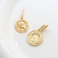 Macro view of 14k gold plated coin charms with embossed goddess and sparkling zircon detail - 18K Gold Portrait