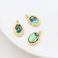 Vista macro di ciondoli ovali in oro 14k con conchiglia di abalone per la creazione di gioielli - Finitura Oro 18k Guscio di Abalone