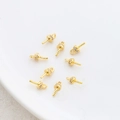 Macro detail of 18k gold plated pearl bail pegs with sparkling zircon stone settings - Gold