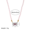Pink beaded necklace with ceramic butterfly pendant and length dimension details - Bow (Pink Beaded Style)