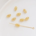 Primer plano de cuentas espaciadoras de malla hueca bañadas en oro 14K para joyería - Óvalo hueco / 5x8mm (1 Pieza) / Oro de 18K