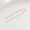 Macro view of 14K gold plated tassel earring chain needle on white ceramic plate - 18K Gold Plated