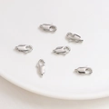 Close-up of six polished silver lobster clasps for DIY jewelry making on white ceramic - 10mm / White Gold