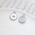 Macro detail of gold-plated rose shell charms with star inlay and spiral texture - Octagram Round Disc (7#)