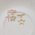 Macro detail of gold star OT toggle clasp set with CZ stones measuring 16mm by 21mm - Five-pointed Star