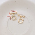 Macro view of gold plated flower toggle clasp with zircon butterfly for DIY jewelry - Flower and Butterfly Design