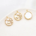 Detail of gold plated Libra constellation pendant with mother of pearl and zircon stones - Libra