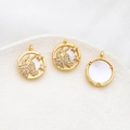Macro detail of Taurus zodiac pendants with gold plating and white shell texture - Taurus