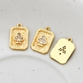 Macro shot of gold-plated playing card charms with zircon clover inlay for DIY jewelry making - Plum Blossom Style