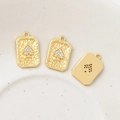 Macro detail of rectangle gold playing card pendants with zircon spade and hammered texture - Spades Style