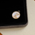 Gold plated pendant with letter K set in white mother of pearl and zircon stones - Letter K
