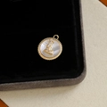 Gold plated round letter L pendant with mother of pearl inlay and sparkling zircons - Letter L