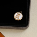 Gold plated pendant featuring mother of pearl and letter R encrusted with zircon - Letter R