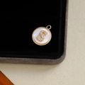 18k gold plated round pendant featuring letter S in cubic zirconia on white shell inlay - Letter S