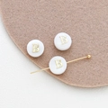 Macro detail of 8mm round shell beads with golden letter B and a long needle tool - Letter B (2#B Single Price)