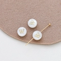 Macro detail of white shell alphabet beads with gold letter W for DIY jewelry - Letter W (23#W Single Price)