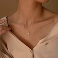 Collana a doppio strato in oro con ciondoli a raggiera e zircone rotondo da donna - Stella a Otto Punte (Oro)