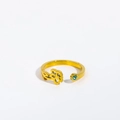 Detail of gold titanium ring with flower cutout and teal gemstone on a white background - Adjustable Open / March/Daffodil