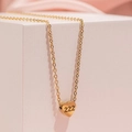 Close-up of golden heart pendant featuring engraved 222 number on a fine O-chain - Style 222