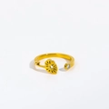 Detail of gold titanium ring featuring a floral totem and a sparkling round zircon stone - Adjustable Open / April/Daisy