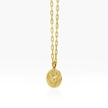 Gold paperclip chain necklace featuring a hollow round pendant with profile face design - Virgo