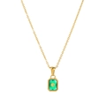 Detailed close-up of emerald green crystal pendant with gold star on dainty titanium chain - Necklace / May - Gold