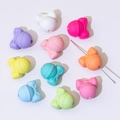 Macro shot of colorful silicone beads with bow tie design and vertical holes for DIY crafts - Bell (20*19mm)